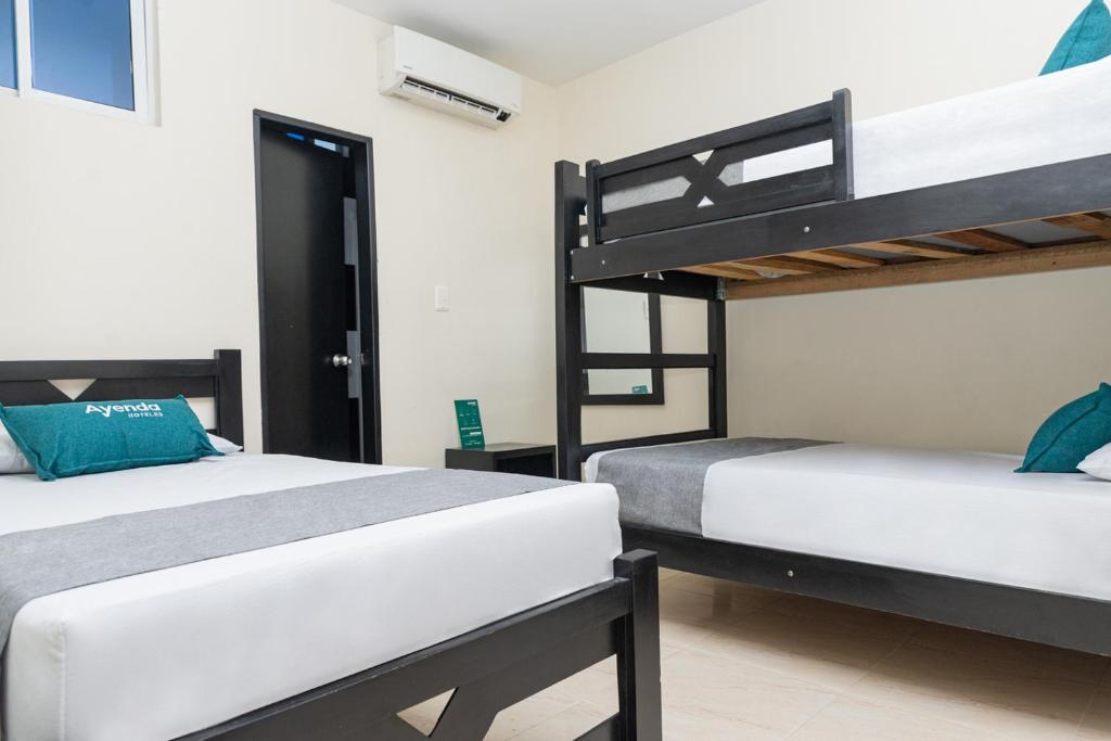 Postel nebo postele na pokoji v ubytování Hotel Itaka