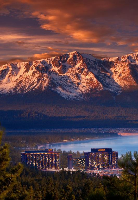 a view of a city with mountains in the background at Harrah's Lake Tahoe Hotel & Casino in Stateline
