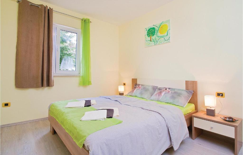 Łóżko lub łóżka w pokoju w obiekcie Apartment Orbanici 03