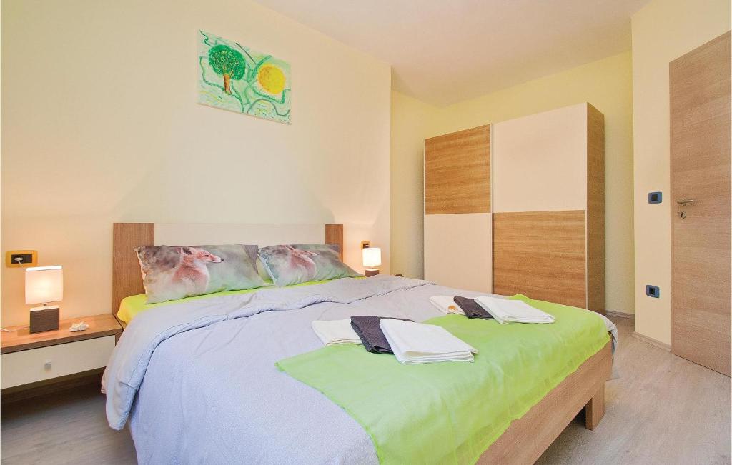 Łóżko lub łóżka w pokoju w obiekcie Apartment Orbanici 03