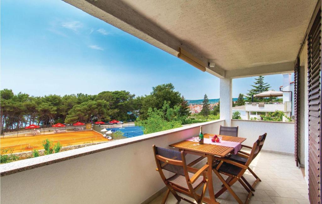 a table and chairs on a balcony with a view at 3 Bedroom Beautiful Apartment In Krk in Krk