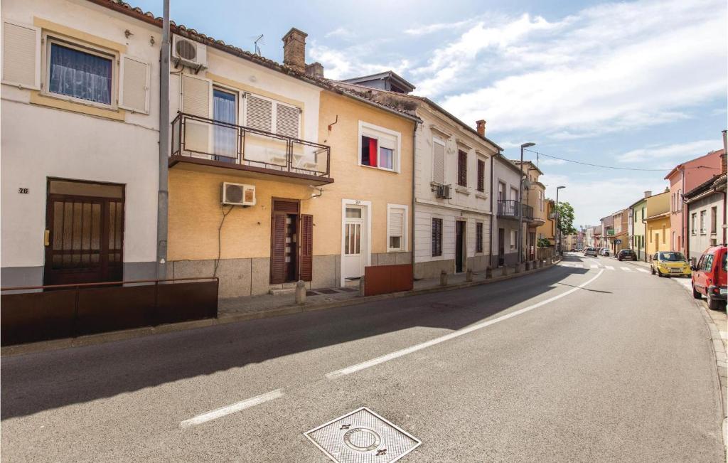 an empty street in a town with buildings at 3 Bedroom Nice Home In Crikvenica in Crikvenica