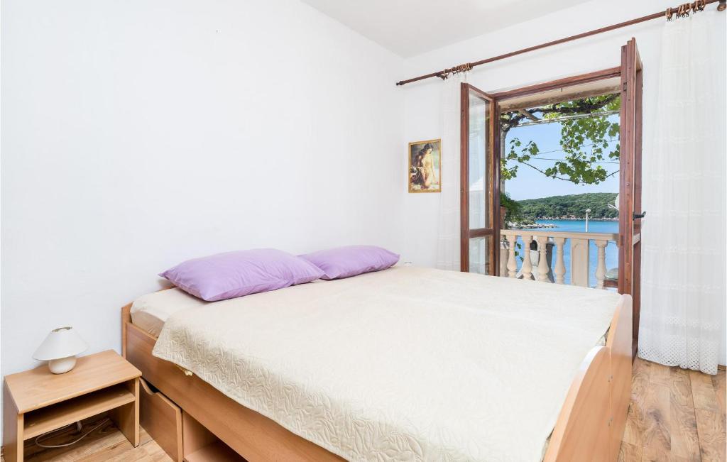 Postel nebo postele na pokoji v ubytování Apartment Gruda Molunat Ii