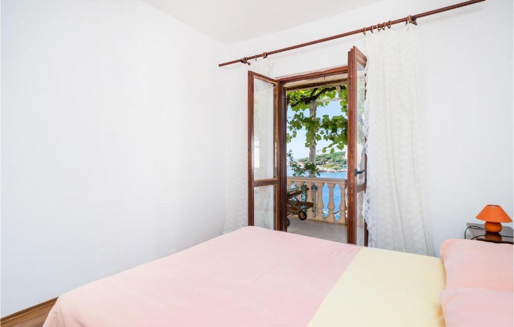 Postel nebo postele na pokoji v ubytování Apartment Gruda Molunat Ii