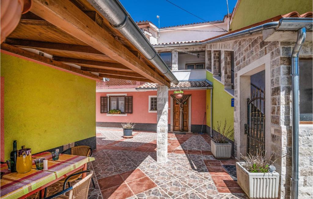 an empty courtyard of a house with colorful walls at Awesome Apartment In Zminj With 2 Bedrooms And Wifi in Žminj