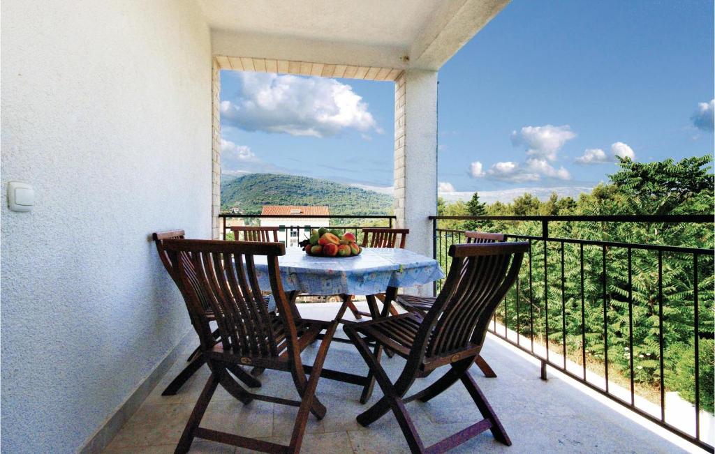 a table and two chairs on a balcony with a view at Awesome Apartment In Stari Grad With Wifi in Stari Grad