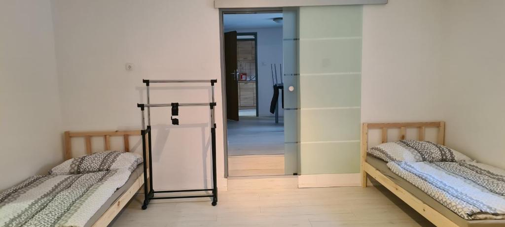Postel nebo postele na pokoji v ubytování SG Apartment