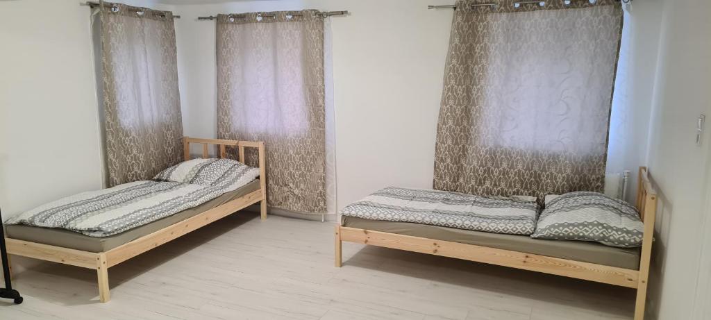Postel nebo postele na pokoji v ubytování SG Apartment