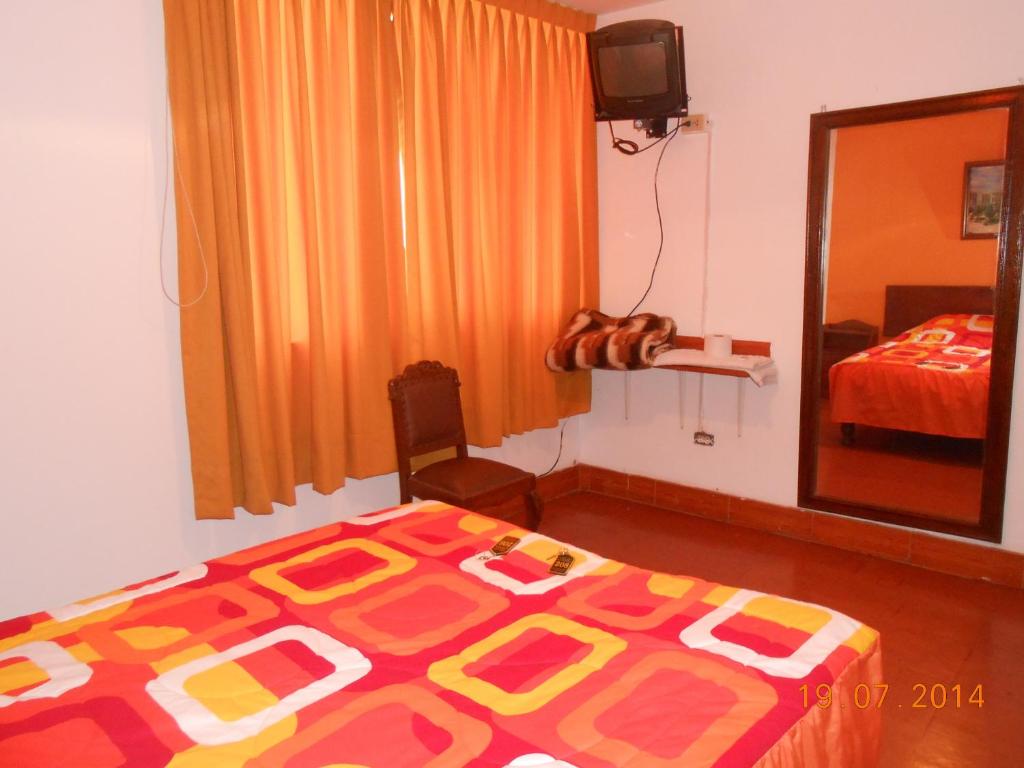 Postel nebo postele na pokoji v ubytování Hostal Cesar Alberto