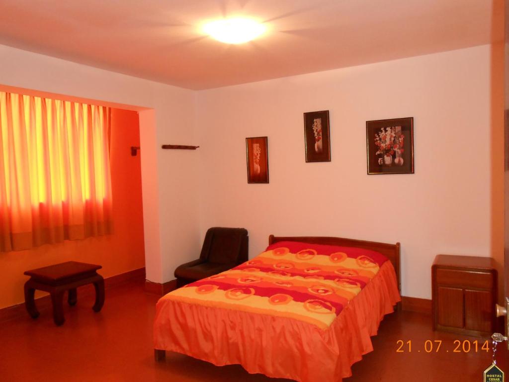 Postel nebo postele na pokoji v ubytování Hostal Cesar Alberto