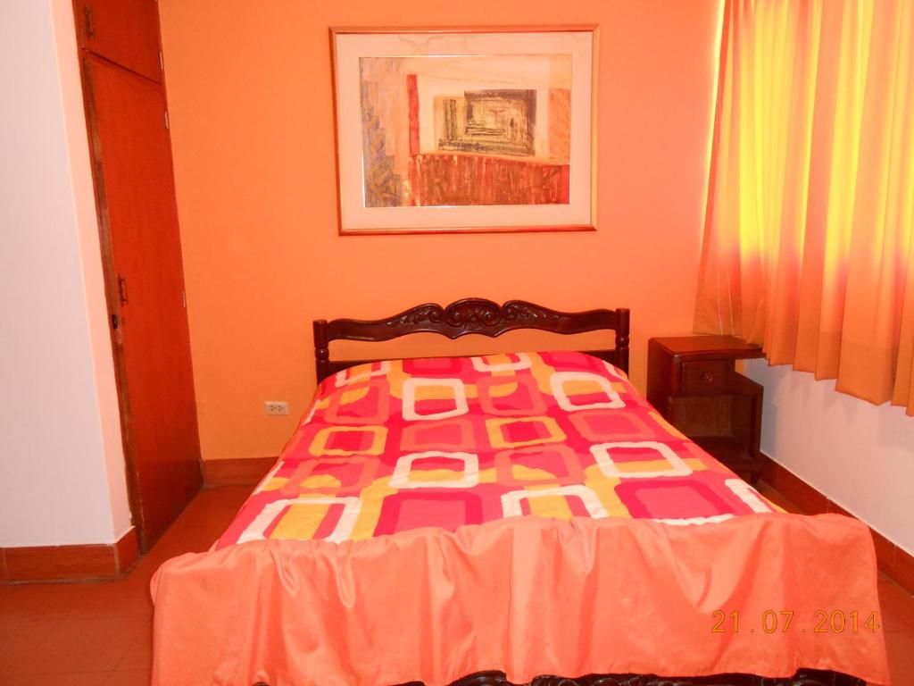 Postel nebo postele na pokoji v ubytování Hostal Cesar Alberto
