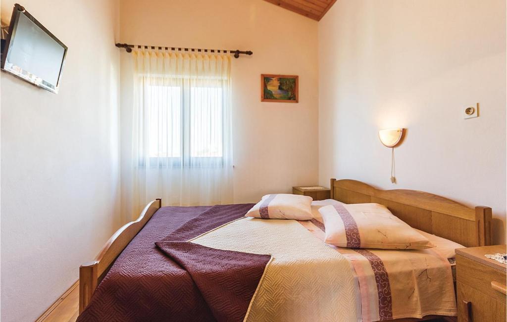 Łóżko lub łóżka w pokoju w obiekcie Apartment Pomer Cr
