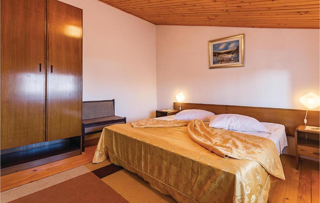 Łóżko lub łóżka w pokoju w obiekcie Apartment Pomer Cr
