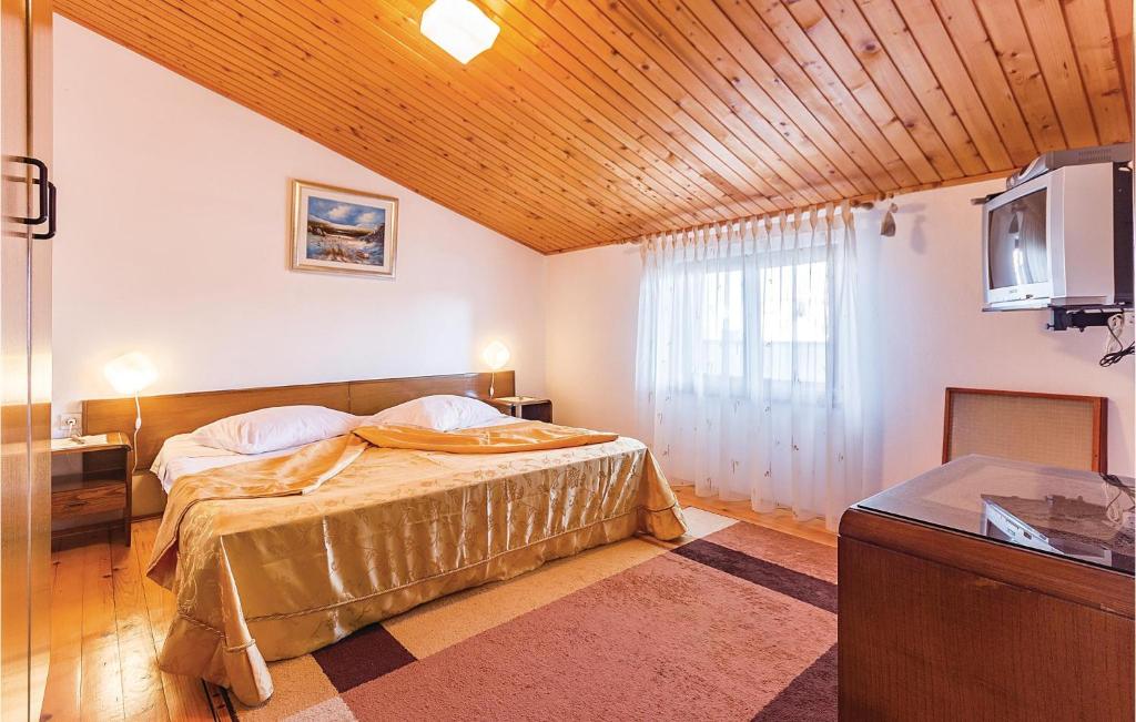 Łóżko lub łóżka w pokoju w obiekcie Apartment Pomer Cr
