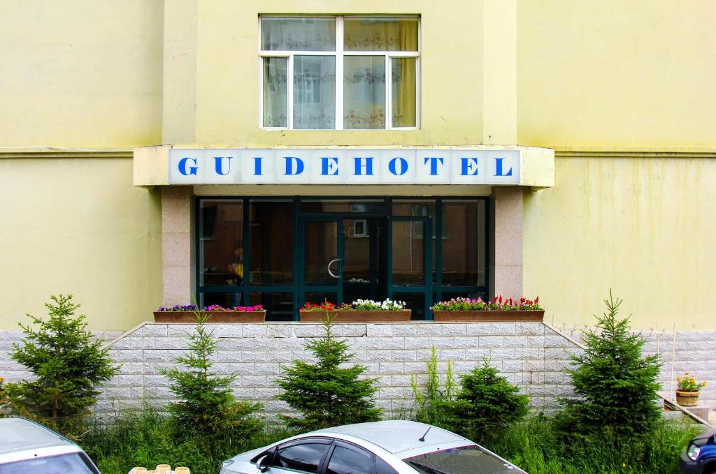 a building with a sign that reads guildford at Guide Hotel in Ulaanbaatar