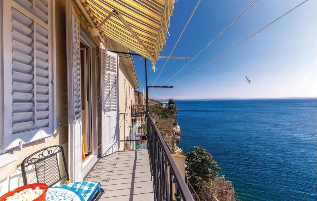 a balcony with a view of the ocean at Gorgeous Apartment In Rijeka With Kitchen in Rijeka