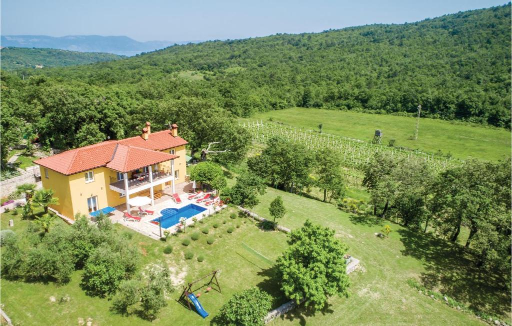 an aerial view of a house in a vineyard at 4 Bedroom Beautiful Home In Kranjci in Raša