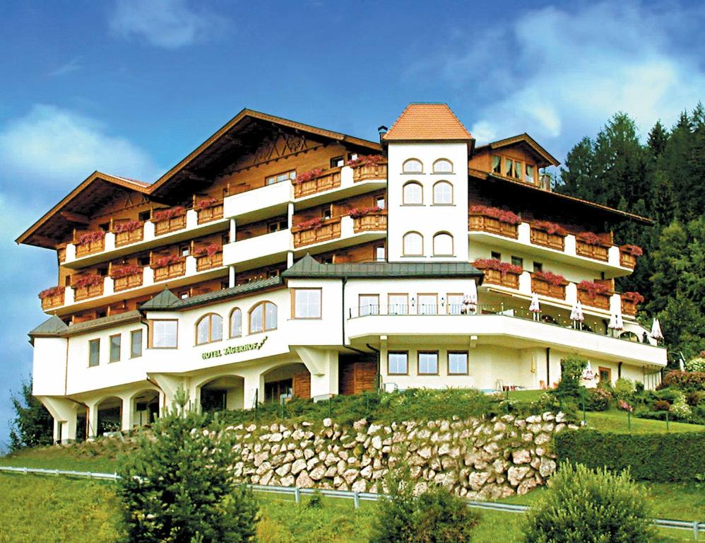 a large building on top of a hill at Hotel Jägerhof in Kolsassberg