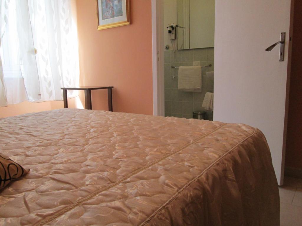 Posteľ alebo postele v izbe v ubytovaní B&B Regina Margherita