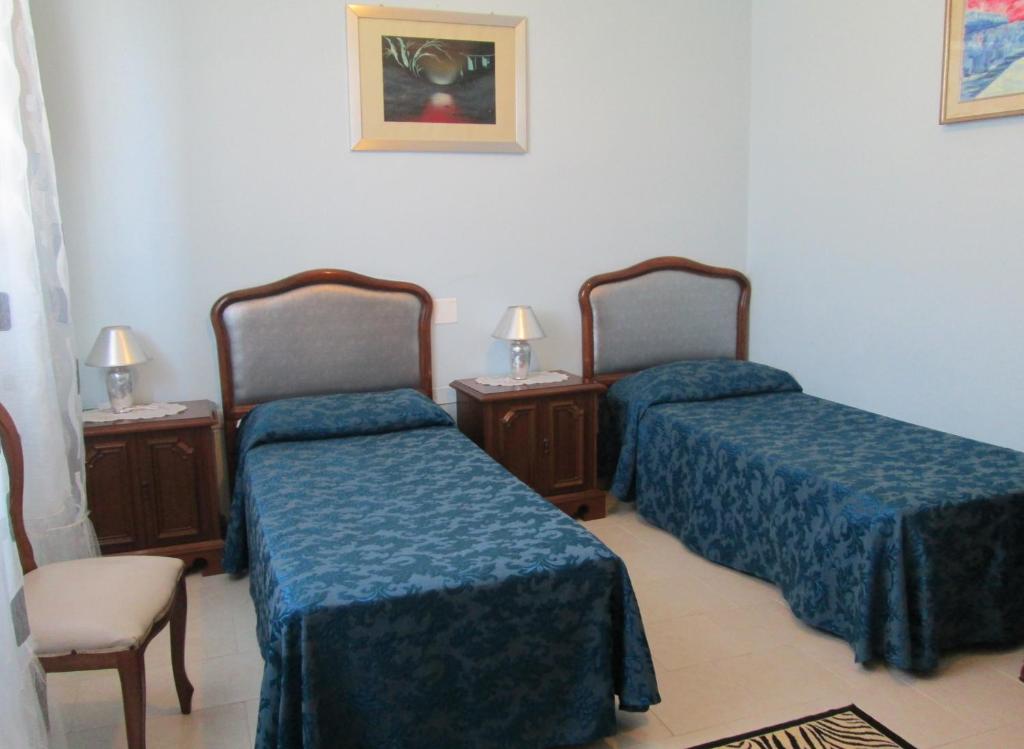 Posteľ alebo postele v izbe v ubytovaní B&B Regina Margherita