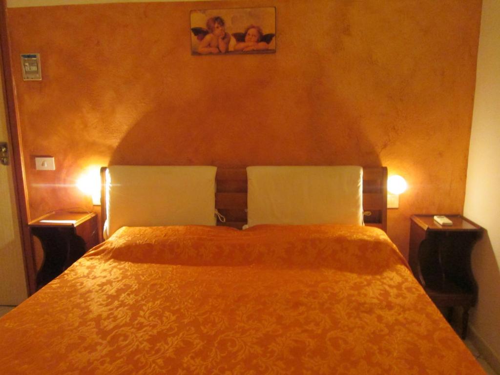Posteľ alebo postele v izbe v ubytovaní B&B Regina Margherita