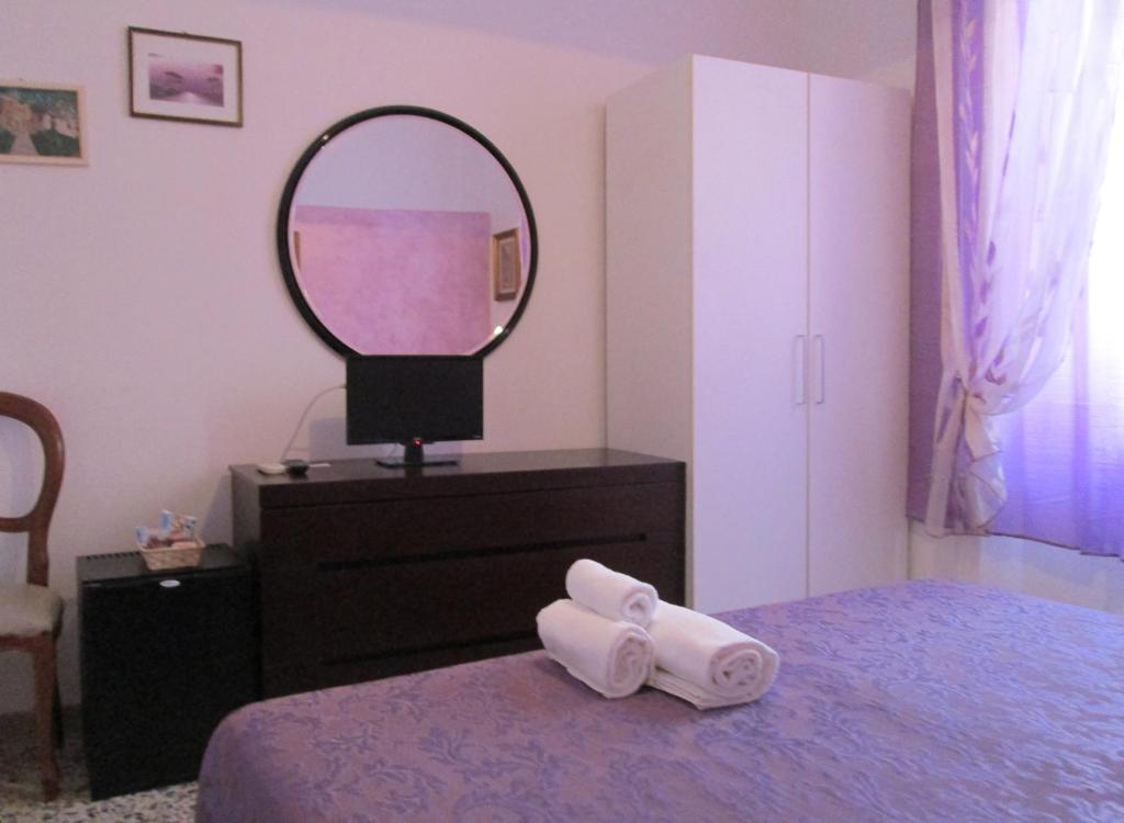 Posteľ alebo postele v izbe v ubytovaní B&B Regina Margherita