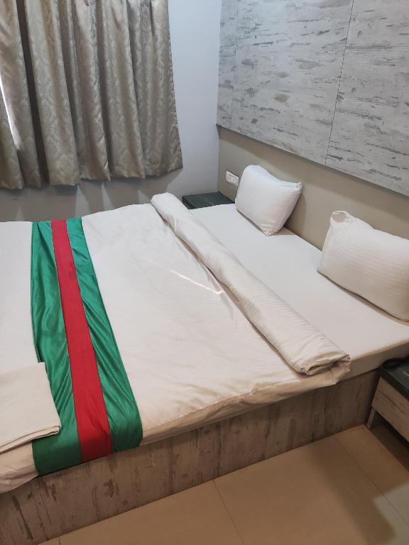 Postel nebo postele na pokoji v ubytování Hotel Green Apple