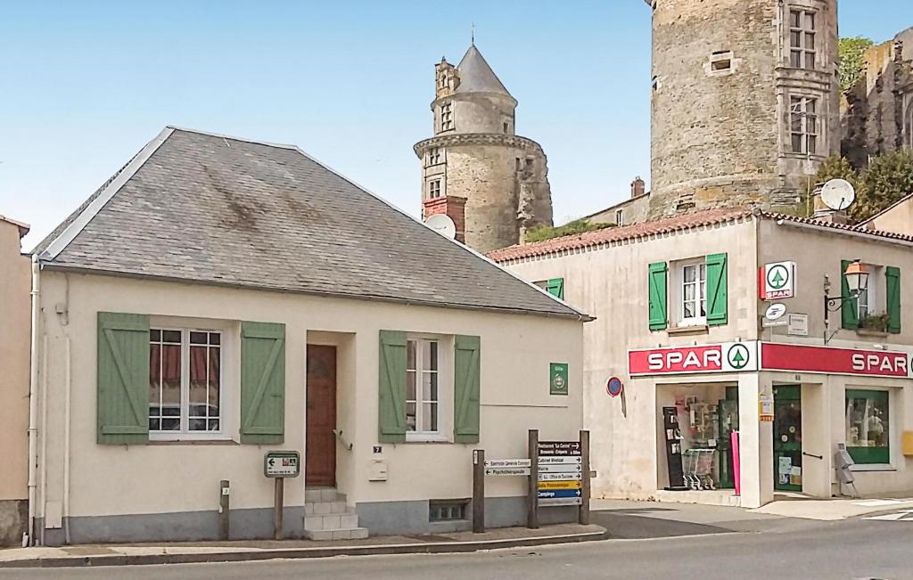 an old building on the corner of a street with a castle at 2 Bedroom Stunning Home In Apremont in Apremont