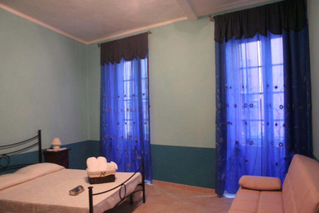 Postel nebo postele na pokoji v ubytování B&B Su Maimoni