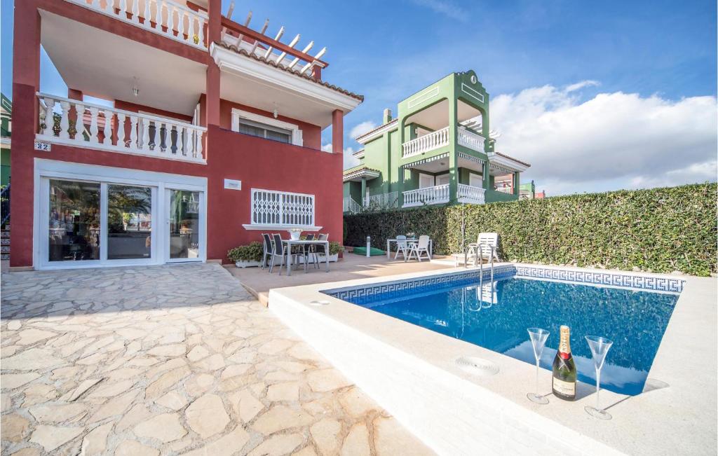 a house with a swimming pool next to a building at Villa Carolina Peñíscola in Peñíscola