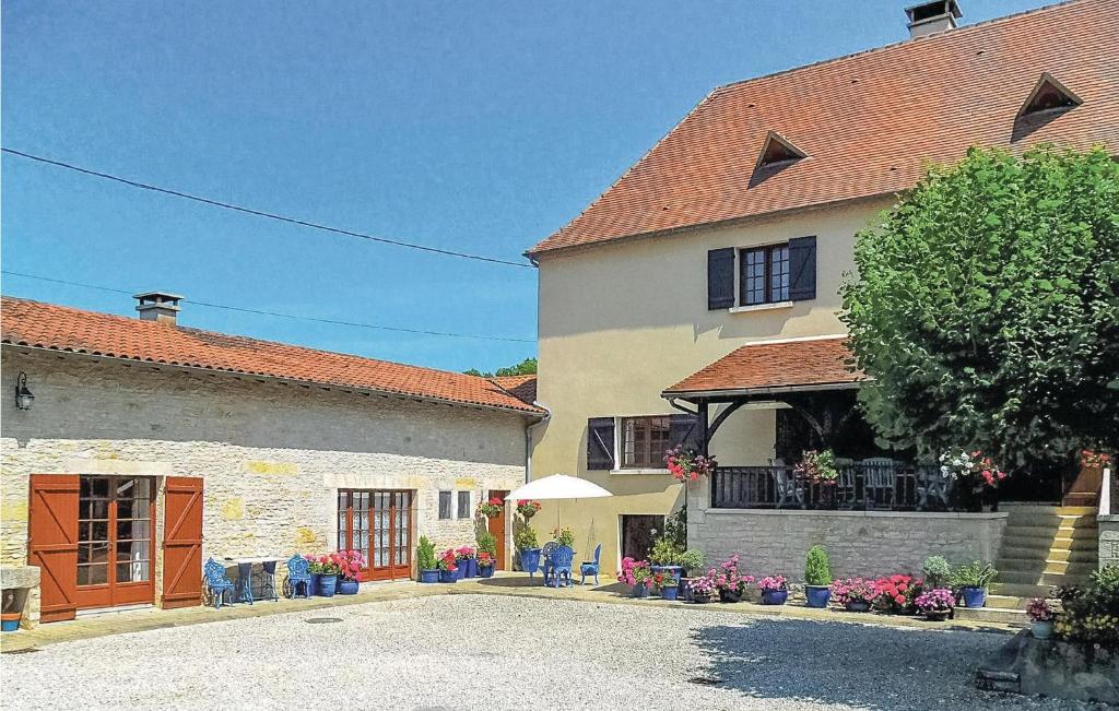 a group of buildings in a town with a driveway at Awesome Home In Gabillou With Wifi in Gabillou
