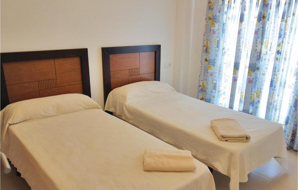 A bed or beds in a room at Hacienda Riquelme