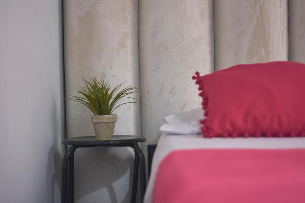 Letto o letti in una camera di Hostal Casa Estación