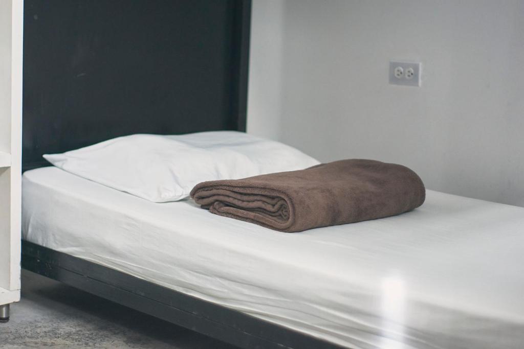 Letto o letti in una camera di Hostal Casa Estación