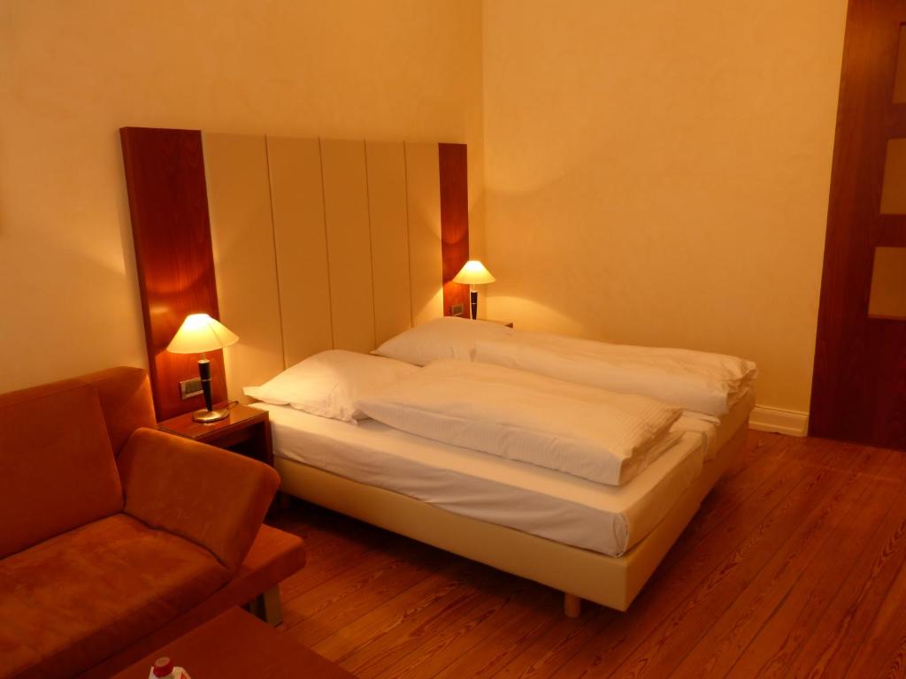 Postel nebo postele na pokoji v ubytování Hotel Vorbach