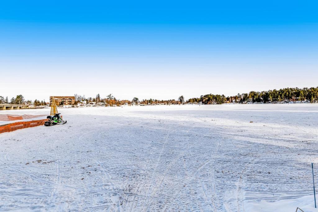 a person on a snowmobile on a frozen lake at Lake Minocqua Lakeview in Minocqua