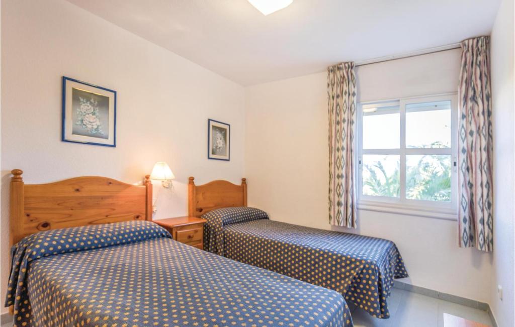 Postel nebo postele na pokoji v ubytování Cozy Apartment In Roquetas De Mar