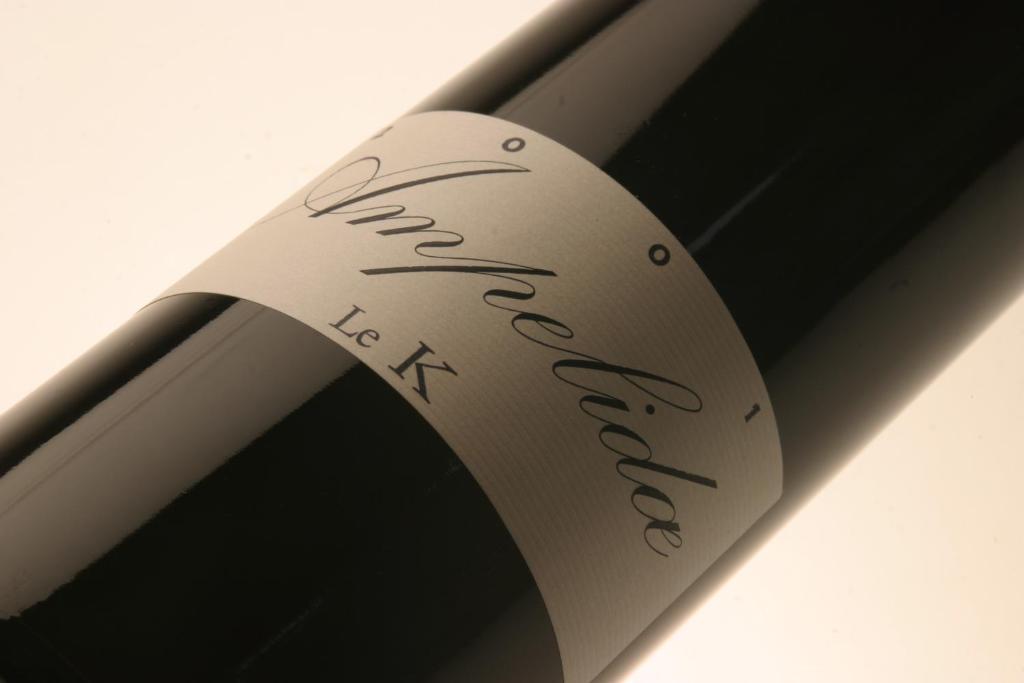 a close up of a wine bottle with handwriting on it at Le Relais du Lyon d&#39;Or in Angles-sur-lʼAnglin