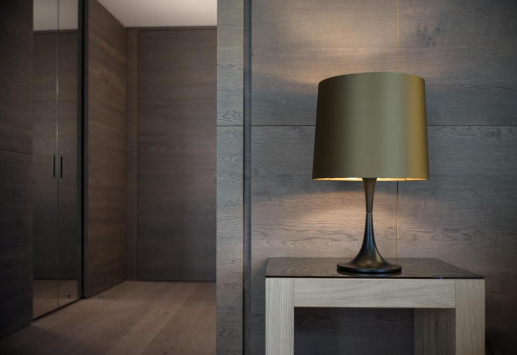 a lamp sitting on a table in a room at ElisabethHotel Premium Private Retreat- Adults only in Mayrhofen