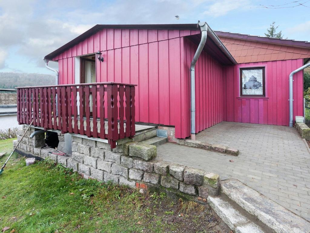 a pink building with a ramp leading up to it at Quaint Holiday Home in G ntersberge near Lake in Güntersberge