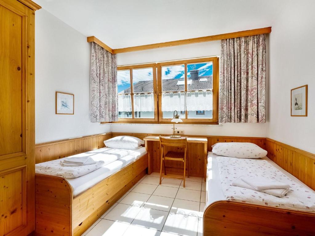 Postel nebo postele na pokoji v ubytování Ferienwohnung am Felsennest Berchtesgadener Land