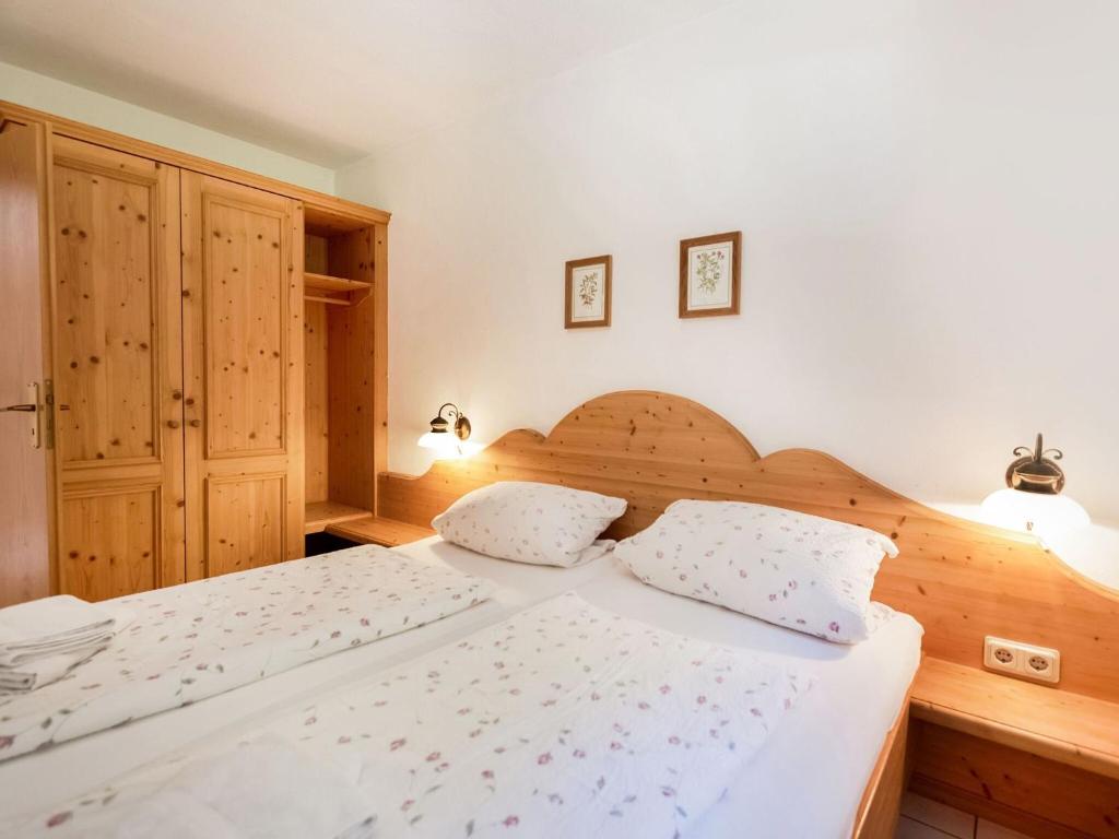 Postel nebo postele na pokoji v ubytování Ferienwohnung am Felsennest Berchtesgadener Land