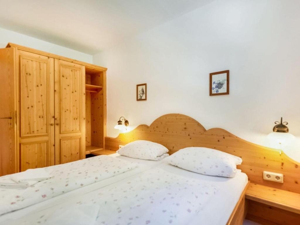 Postel nebo postele na pokoji v ubytování Ferienwohnung am Felsennest Berchtesgadener Land
