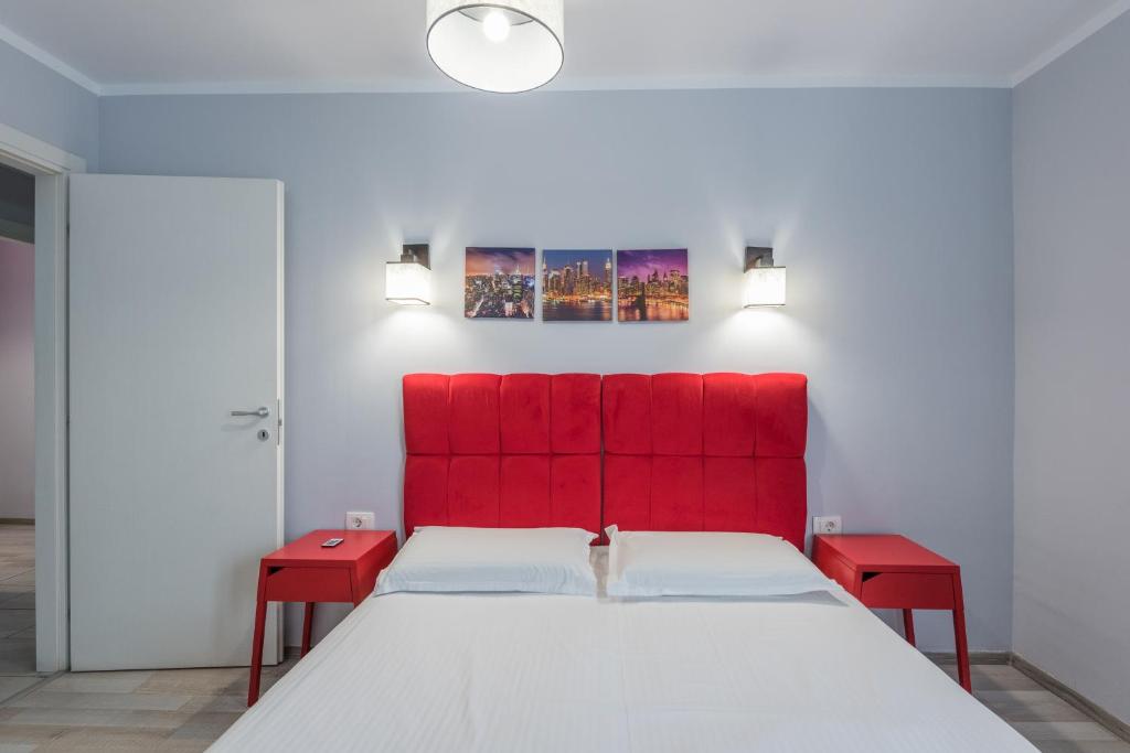 Postel nebo postele na pokoji v ubytování Harmony Residence