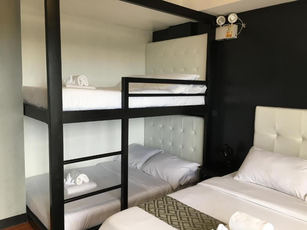 Postel nebo postele na pokoji v ubytování Rangya Hotel