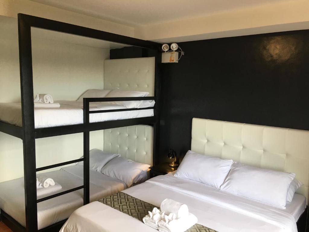 Postel nebo postele na pokoji v ubytování Rangya Hotel