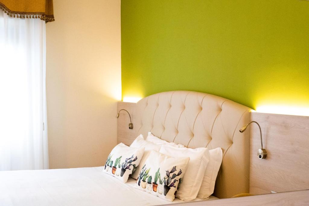Łóżko lub łóżka w pokoju w obiekcie Hotel Castello Artemide Congressi