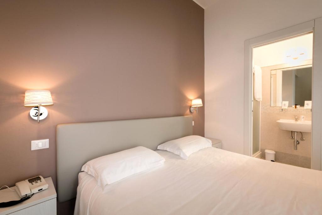 Postel nebo postele na pokoji v ubytování Hotel Saviola