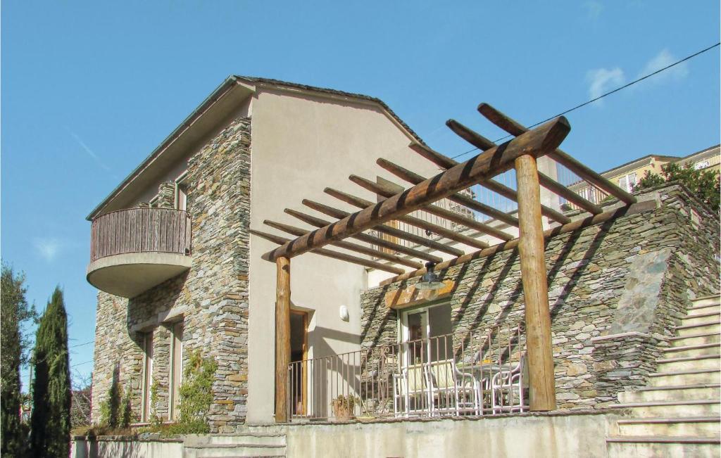 a pergola on the side of a building at Amazing Apartment In Oletta With Kitchen in Oletta