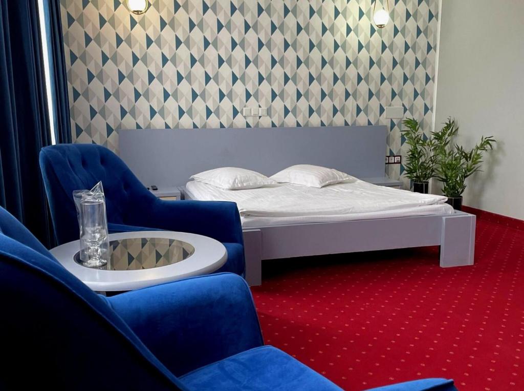 Postel nebo postele na pokoji v ubytování Hotel SunGarden Salin
